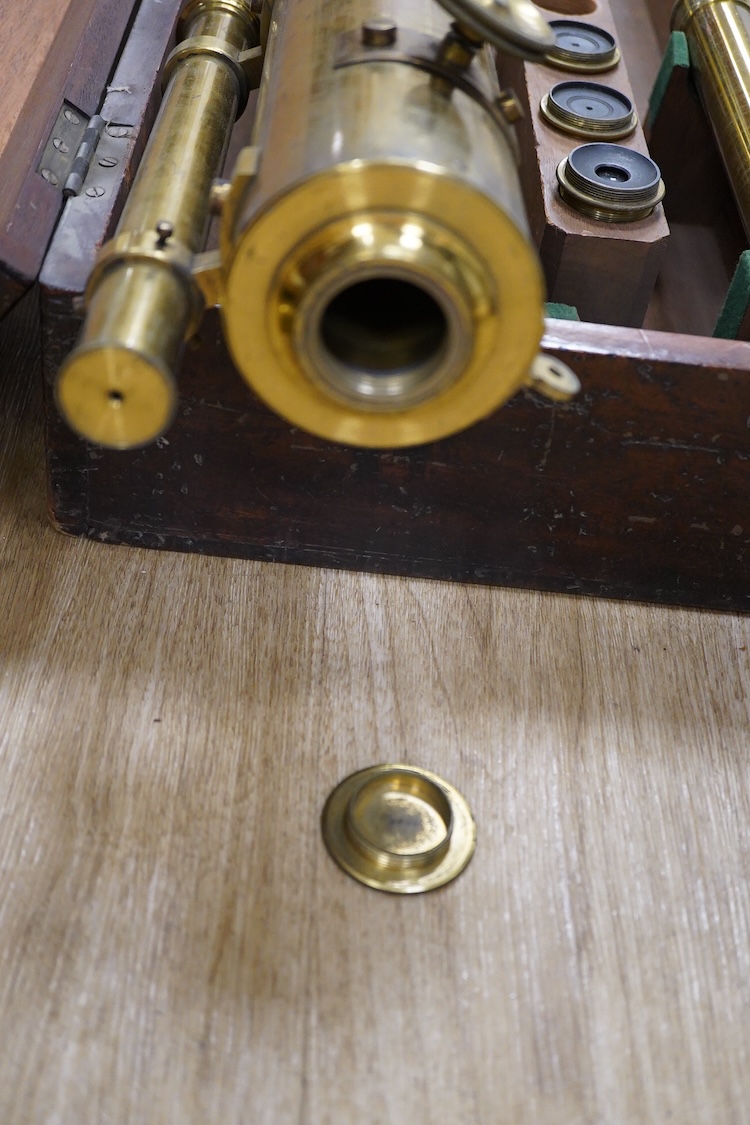 A late 19th century brass single drawer refracting telescope by F.L. West, 39 Southampton Street, Strand, London, in a fitted mahogany case, with folding brass tabletop tripod stand, and a number of alternative lenses, t